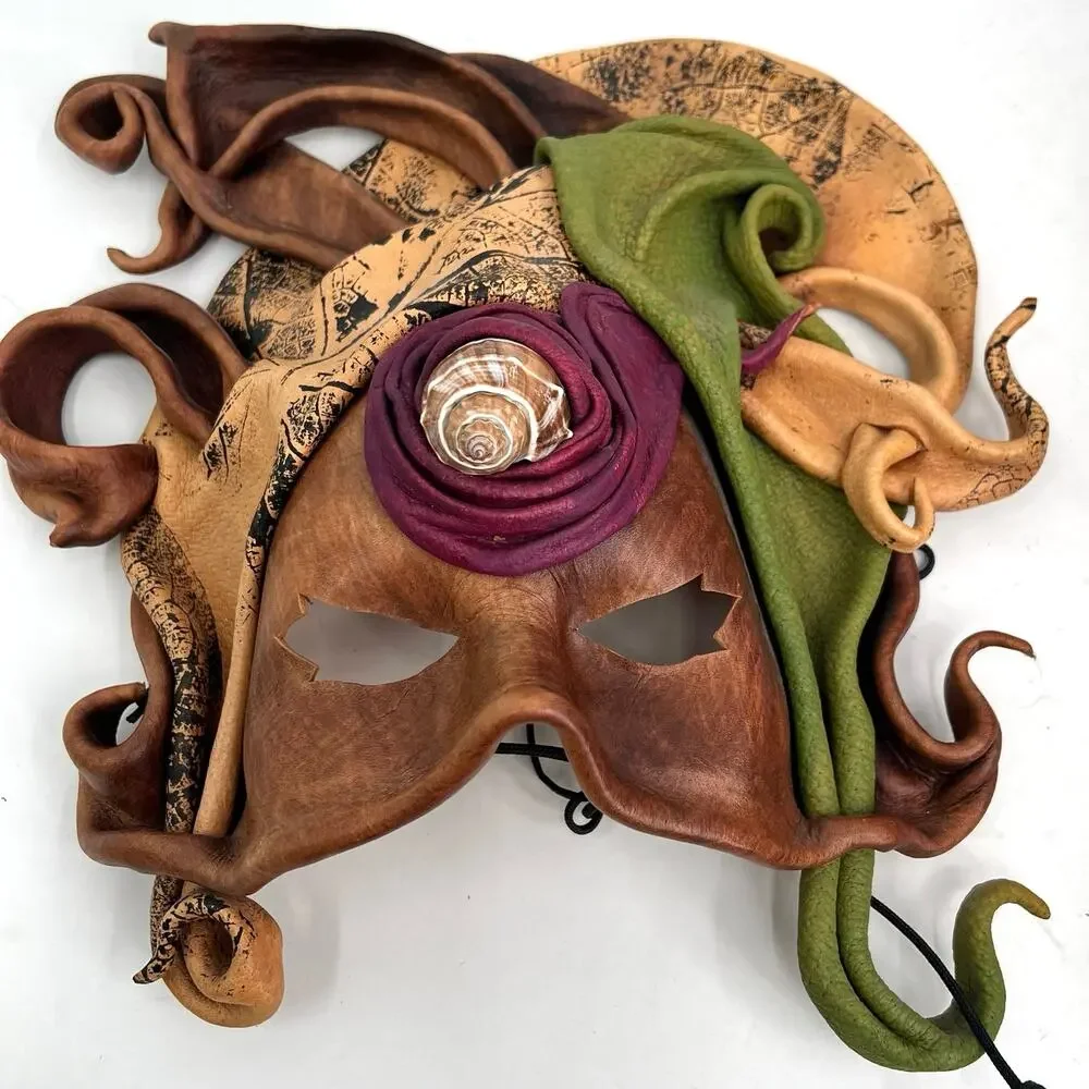 Vintage handcrafted leather masquerade mask with shell